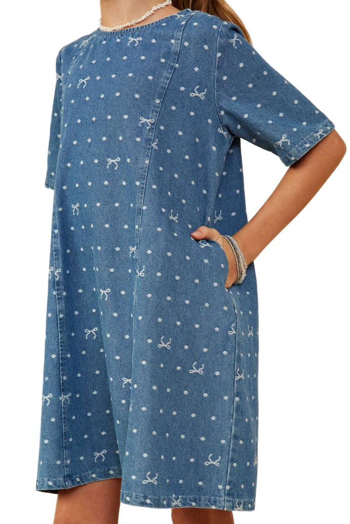 Blue dress with white patterns on a beige background