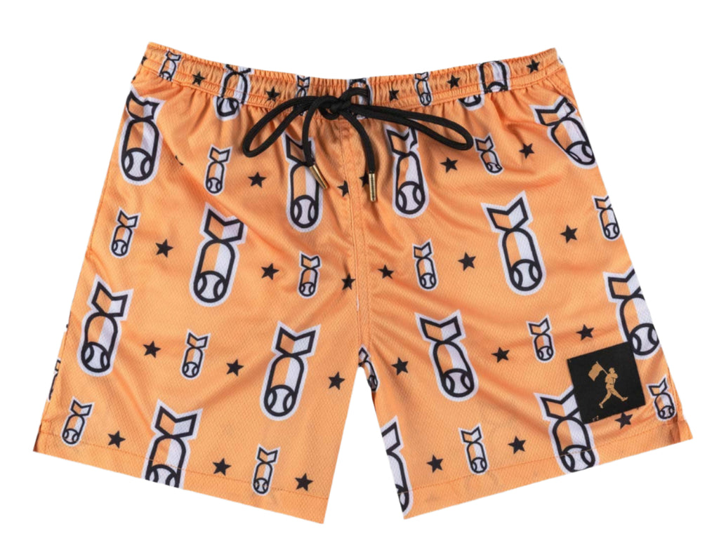 Orange shorts with bomb pattern on a gray background