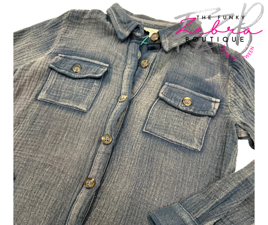 Denim shirt with button details on a white background, featuring 'The Funky Zebra Boutique' logo.