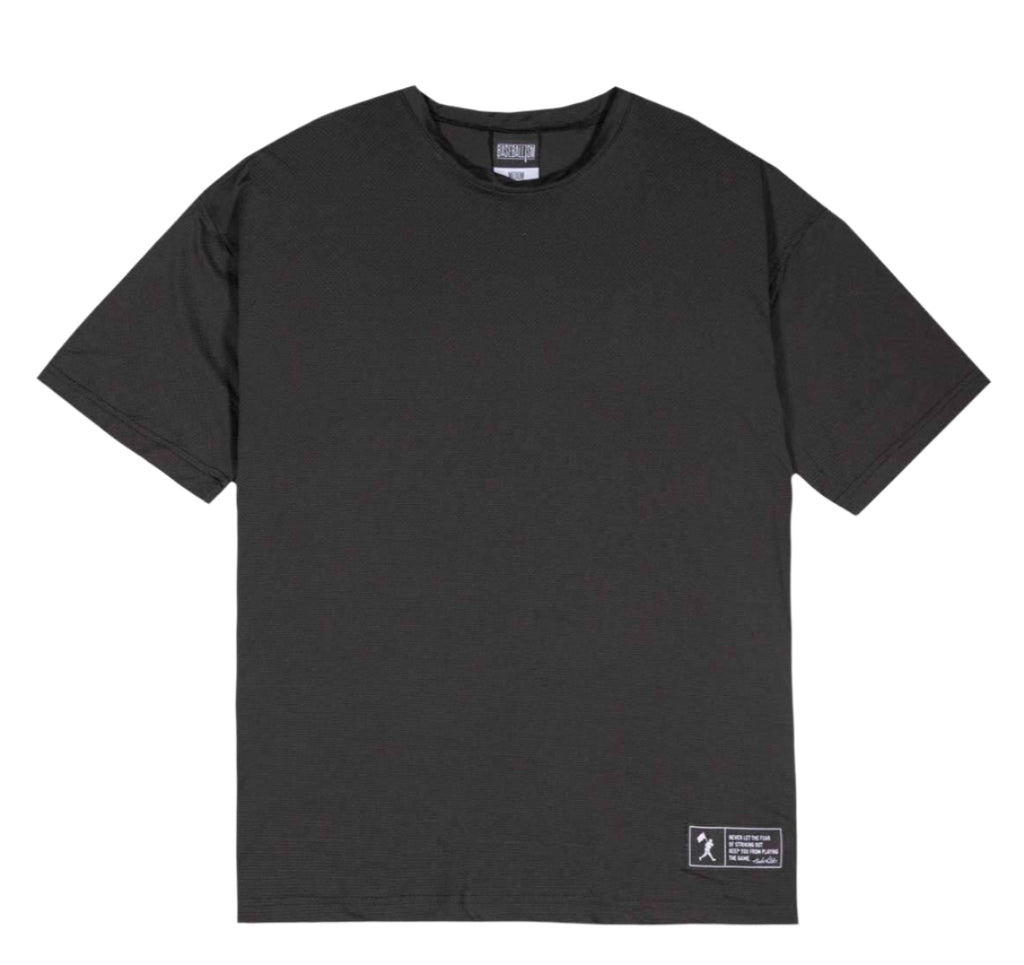 Black t-shirt with a small label on a light gray background